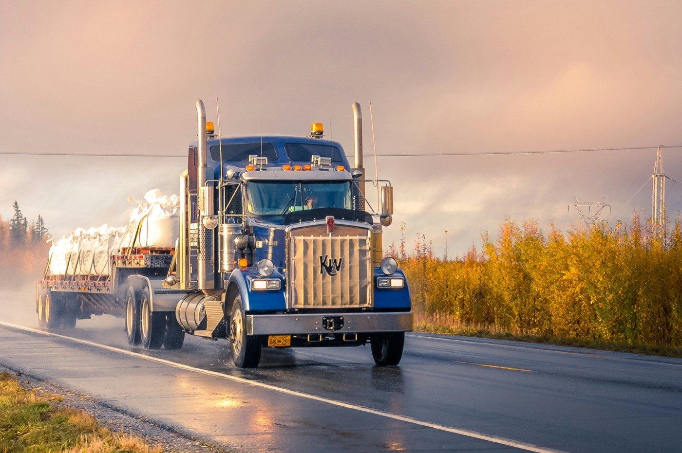 Truck carrying cargo at golden hour